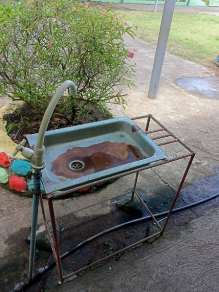 An inadequate water and hygiene facility at a school in Ayungon
