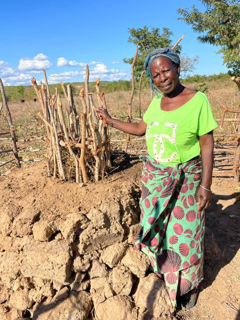 A resident of Shamanjanji beside the community's current water source